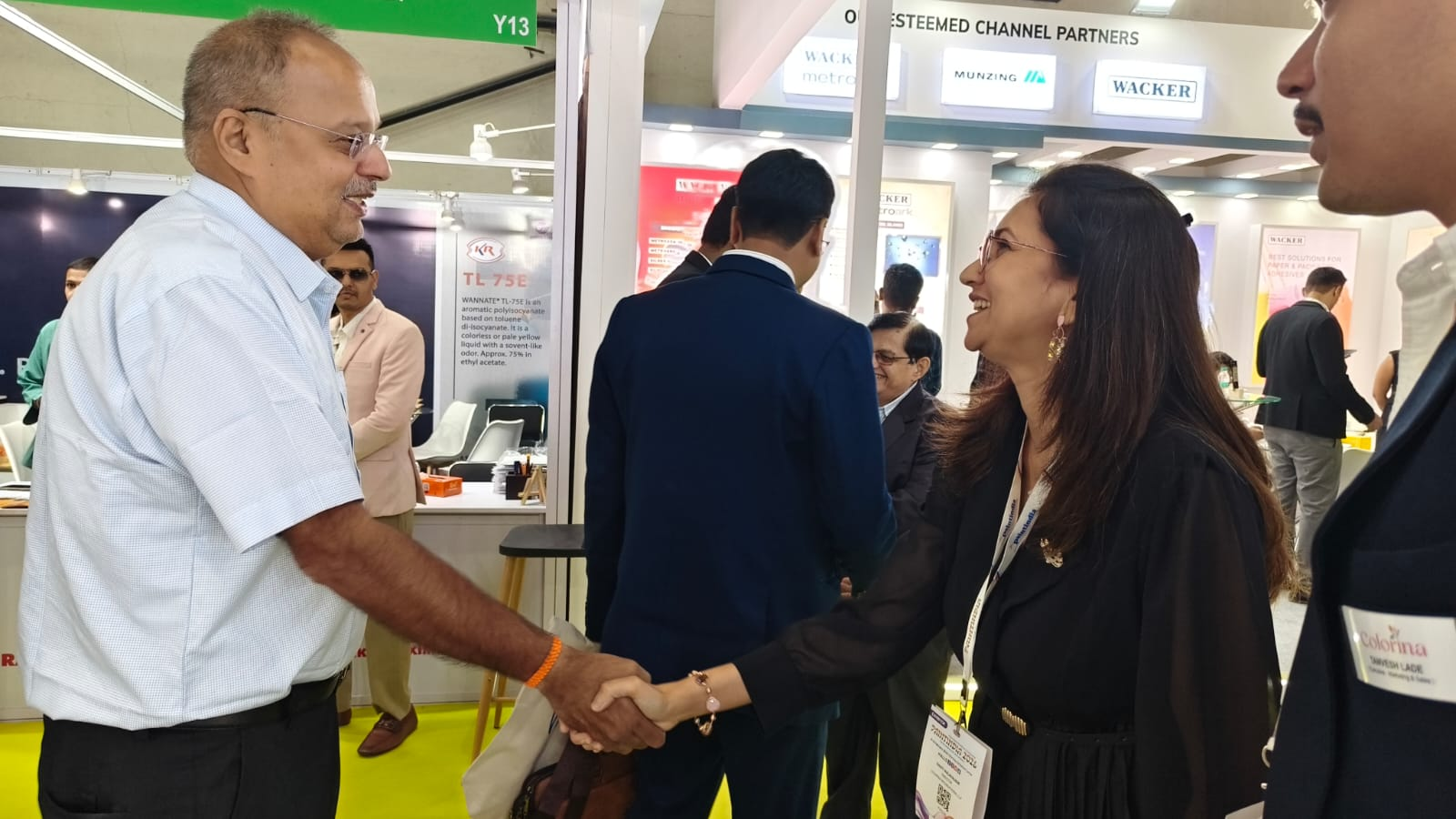 Colorina representative greeting a business partner at the PaintIndia trade fair.